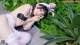 A woman in a bunny costume laying on the ground.